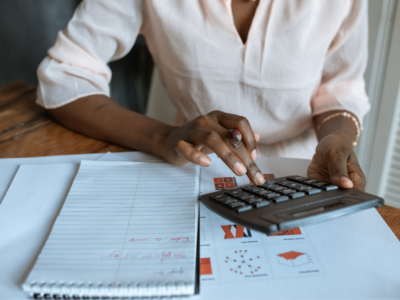 One woman using a calculator.